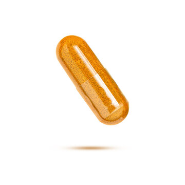Turmeric capsule isolated on white background.