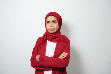 Asian business Muslim woman in red casual with disappointed face