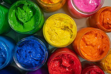 .Top view Collection of colorful smooth gradient background for print fabric and tee shirt. graphic design. .various colors for shirt printing packed in glass bottles lined up.colorful background..