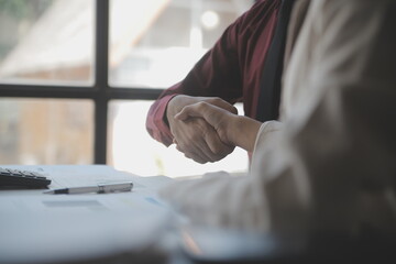 Shot of a asian young business Female working on laptop in her workstation.