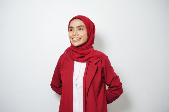 Asian business Muslim woman ini red casual smiling happy and looking confident
