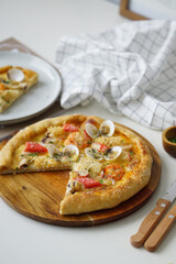 Photo of seafood pizza on the table