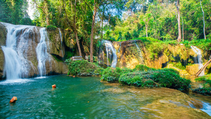 Beautiful tropical raingorest waterfall turquoise water serenity nature landscape