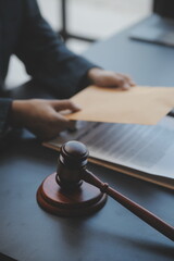 Business and lawyers discussing contract papers with brass scale on desk in office. Law, legal...