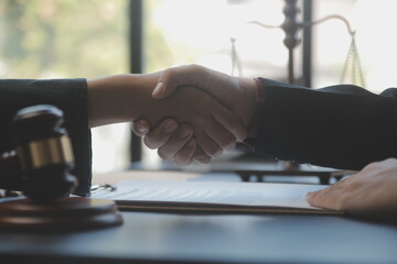 Male lawyer working with contract papers and wooden gavel on tabel in courtroom. justice and law ,attorney, court judge, concept.