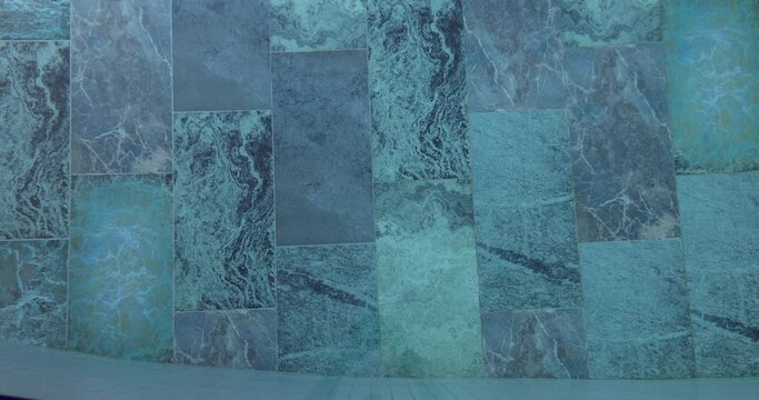 Blue ceramic tile on wall texture background or blue mosaic tile in modern swimming pool. Suitable for interior design