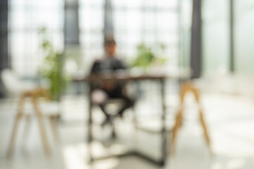 Businessman blur in the workplace in office with computer or shallow depth of focus of abstract...