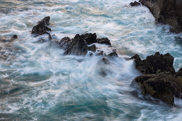 waves crashing on rocks