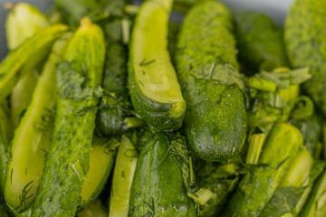 Pickled cucumbers with spices. sliced cucumbers with salt and dill.