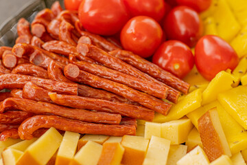 Homemade salami, chorizo and other cured sausages. Dried sausages cut into thin slices