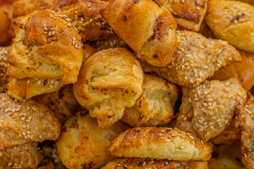 Cheese buns with spices, salty snacks. Bread with cheese filling