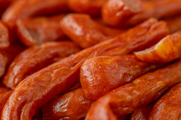 Cured meat with toppings. Homemade salami, chorizo and other cured sausages. Dried sausages cut into thin slices