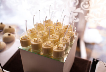 Cakes on a stick on the buffet table during the wedding