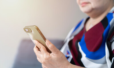 Asian senior elderly woman smile and video call in living room at home.