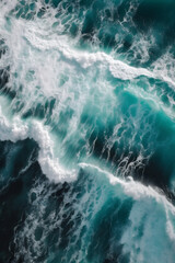 Fototapeta na wymiar Close-up of the blue sea and white waves, overhead shot