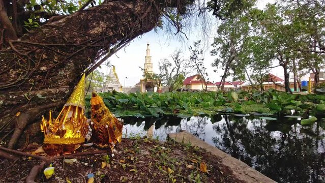 Dreamy and enchanting scene of a golden torma, a ceremonial sacred ritual offering in Tibetan Buddhism in Wat Traeuy Kaoh temple in Kampot, Cambodia