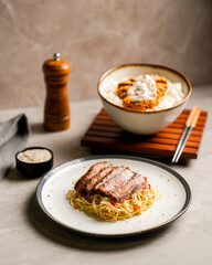 A Portion of Pasta with Beef Slices and Katsu Rice Bowl