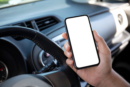man hand hold phone with isolated screen in the car