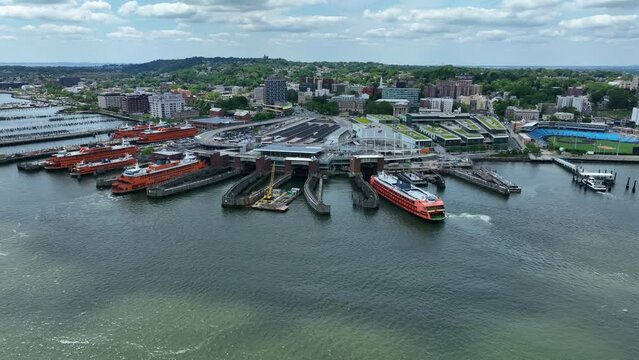 Aerial orbit of Staten Island Ferry terminal. Sightseeing boats for NYC and Statue of Liberty.