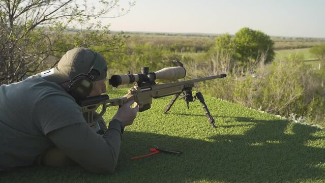 the shooter performs a high-quality exercise with a sniper rifle