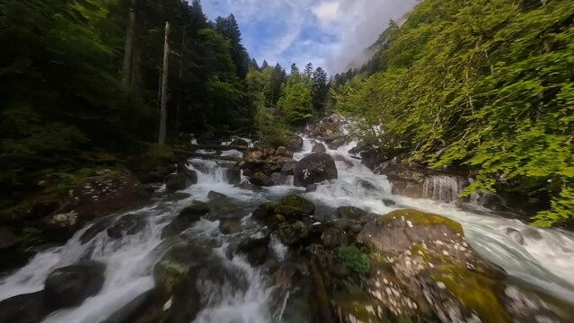 FPV drone video of flying over the Gave du Marcadau waterfall river.