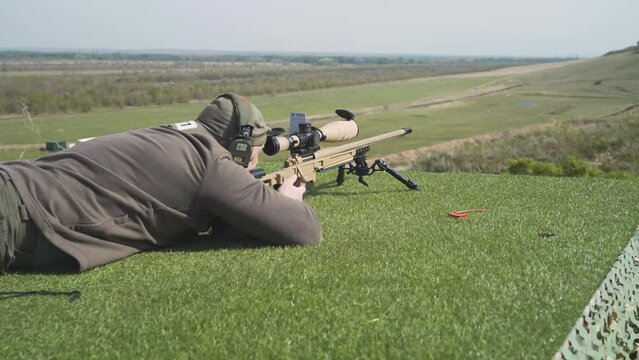 a shooter shoots at a target in a high-precision shooting competition