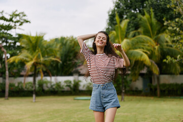 woman lifestyle summer t-shirt beautiful walk smiling bali nature freedom park