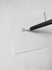 pen and paper, ok written
