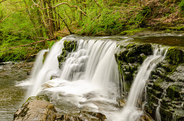 A beautiful slow motion long shutter speed waterfall in Wales forest. Brecon Beacons - UK, England