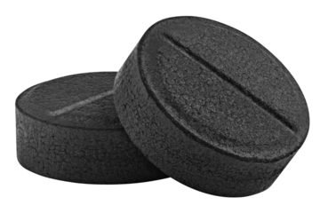 activated Charcoal Pills, isolated on white background, full depth of field