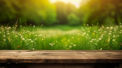 Wooden Table in front of a green meadow with empty space for product display.