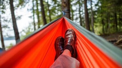 Relaxation at its Best: Close-up View of a Hammock and a Resting Foot, Embracing Leisure and...