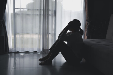 Depression person of a young woman is unhappy. Loneliness man sitting alone. Woman disappointment and hopeless. despair, headache as crying. Man is upset, frustration, tired and negative feeling.