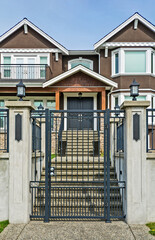 Luxury residential houses with metal gate at the front