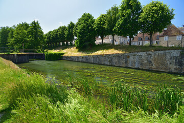 Fototapeta premium France, Montargis. Cityscape with a canal. May 29, 2023.