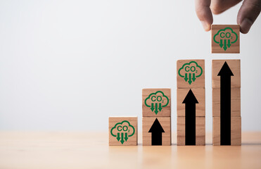 Hand stacking increasing of CO2 reducing icon on cube for decrease CO2 , carbon footprint and carbon credit to limit global warming from climate change, Bio Circular Green Economy concept.
