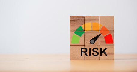 Risk level indicator rating print screen wooden cube block since low to high on blue background for Risk management and assessment concept.