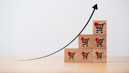 Increasing trend graph of sale volume with bigger shopping trolley cart for  online sale business...