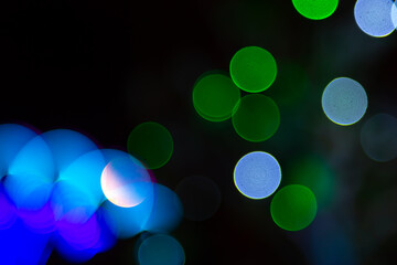 background blurred abstraction of colored lanterns and decorations. bokeh texture of street colored lights