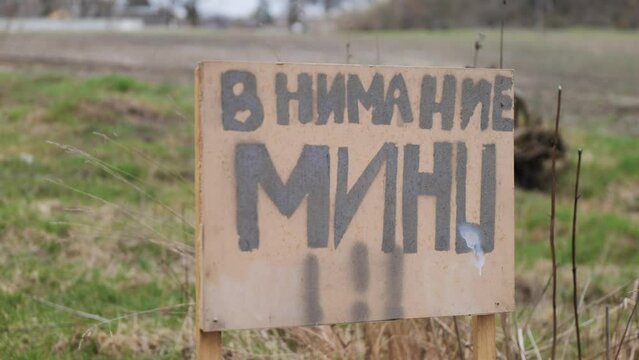Treacherous scene of a minefield, representing the imminent danger and consequences of Russian aggression in Ukraine. 