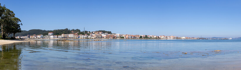 Fototapeta na wymiar Wide Panoramic view of O Grove city, Pontevedra, Spain on sunny day. High resolution