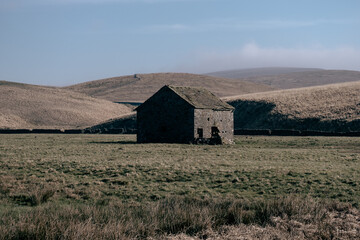 barn in the middle of the field