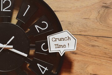 Crunch time note on speech bubble on clock. 