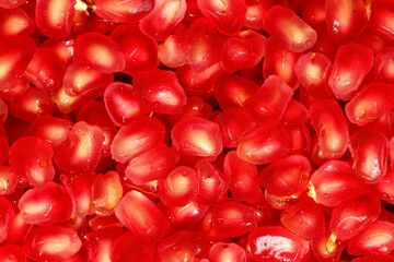 Closeup fresh pomegranate seeds background