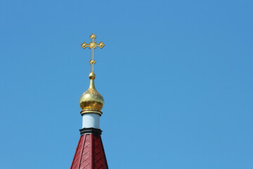 Cross on an Orthodox church against the sky.