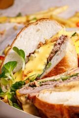 Tasty burger with cheese sauce