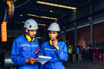 Workers Factory or Engineering work at factory site check up machine or products in site. Foreman or Technician checking Material or Machine on Plant. Heavy industry factory concept.