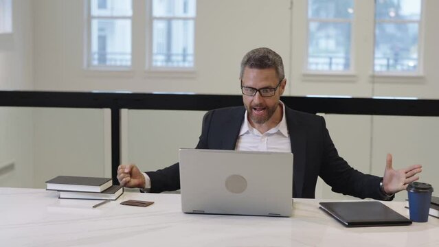 Angry boss broken laptop in office. Businessman broken laptop. Angry stressed businessman crashing laptop. Bad angry man in suit broken laptop. Business problem. Furious crazy man broken computer.