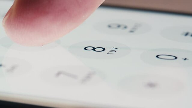 Man dial Spanish phone number, smartphone, cell phone, country code. Finger press a button, white background. High quality studio shot, close up, macro.