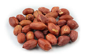 Dried peanuts in closeup isolated on white background.